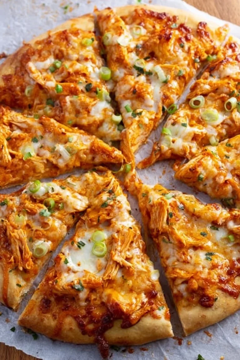 Delicious Buffalo Chicken Pizza topped with spicy chicken, cheese, and ranch drizzle