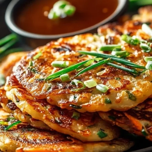 Crispy vegetable pancakes served with Asian dipping sauce
