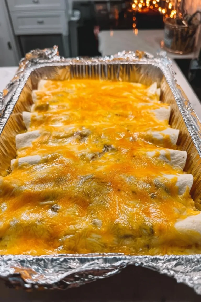 Delicious green chili chicken enchiladas topped with cheese and fresh herbs