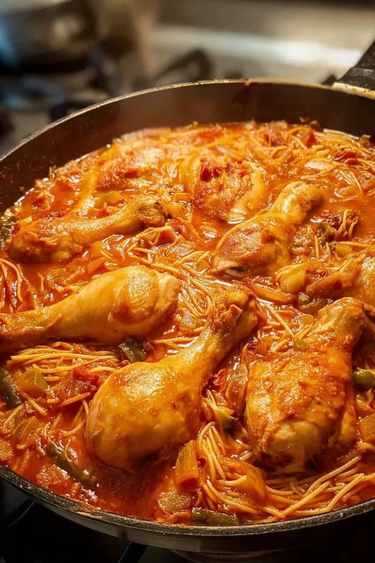 Plate of Noodle with Chicken garnished with herbs and vegetables