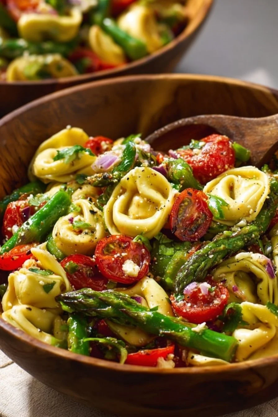 A vibrant springtime salad with fresh vegetables, fruits, and herbs served in a bowl.
