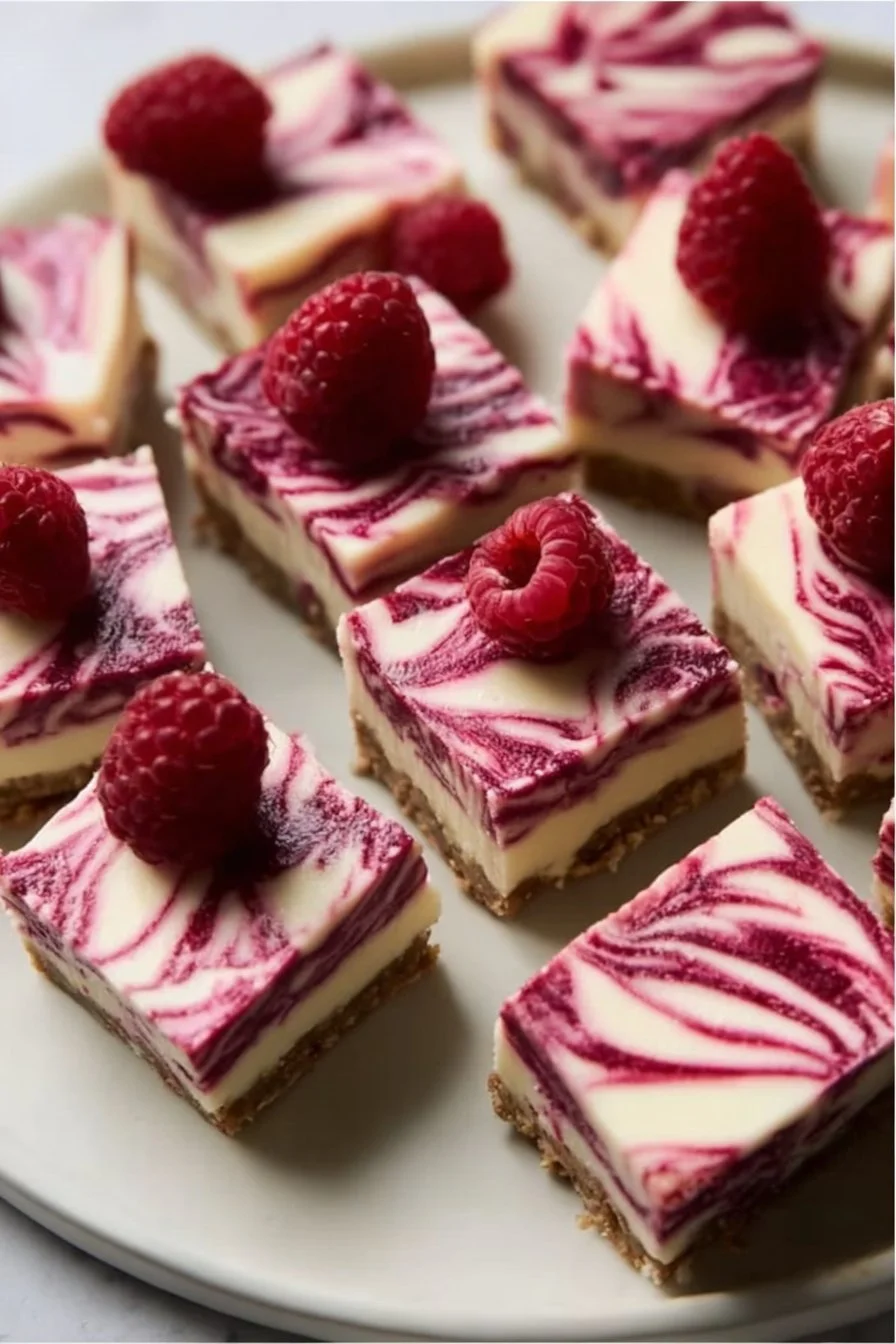 Delicious vegan raspberry cheesecake bars served on a plate