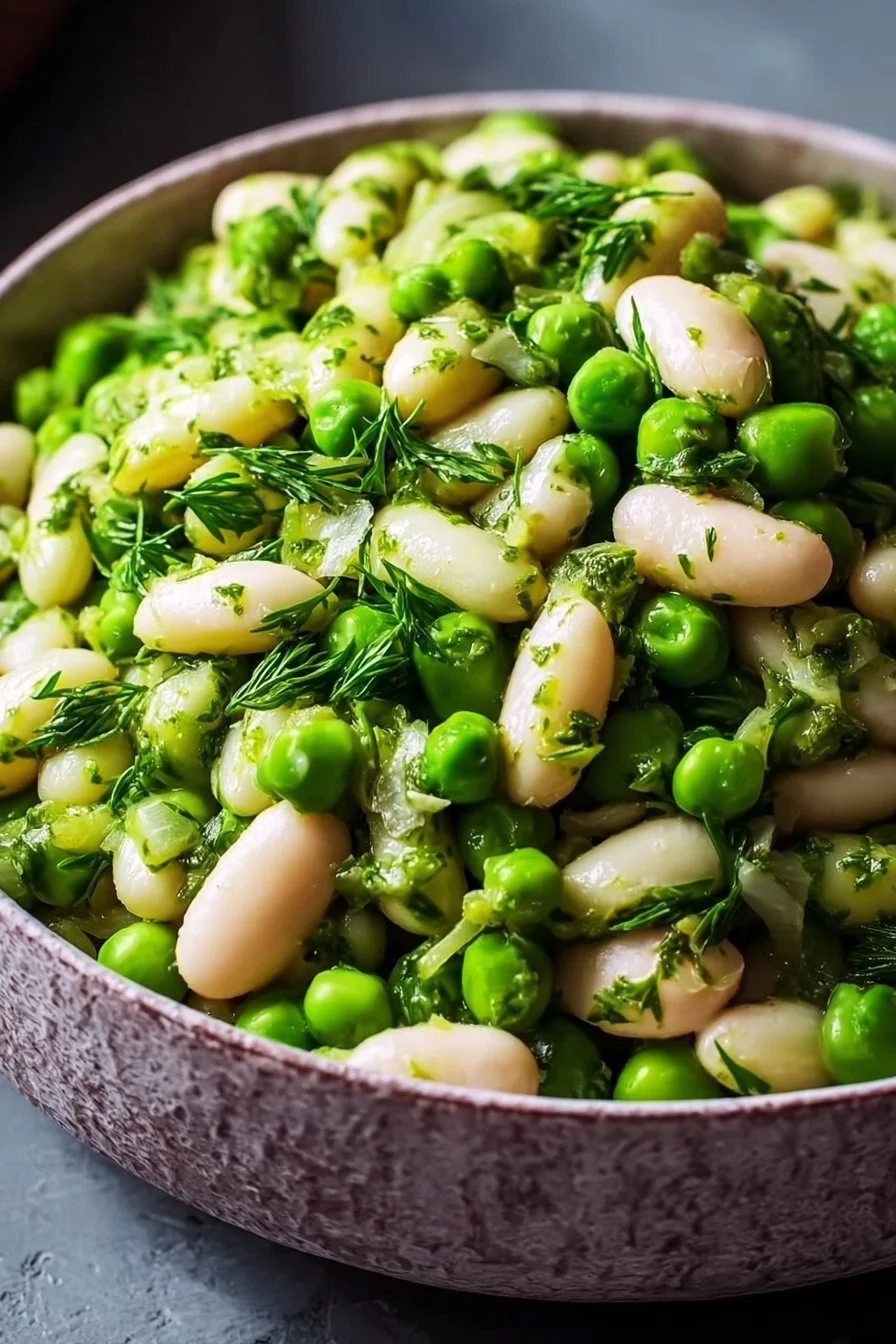 White bean and pea salad with fresh vegetables and dressing