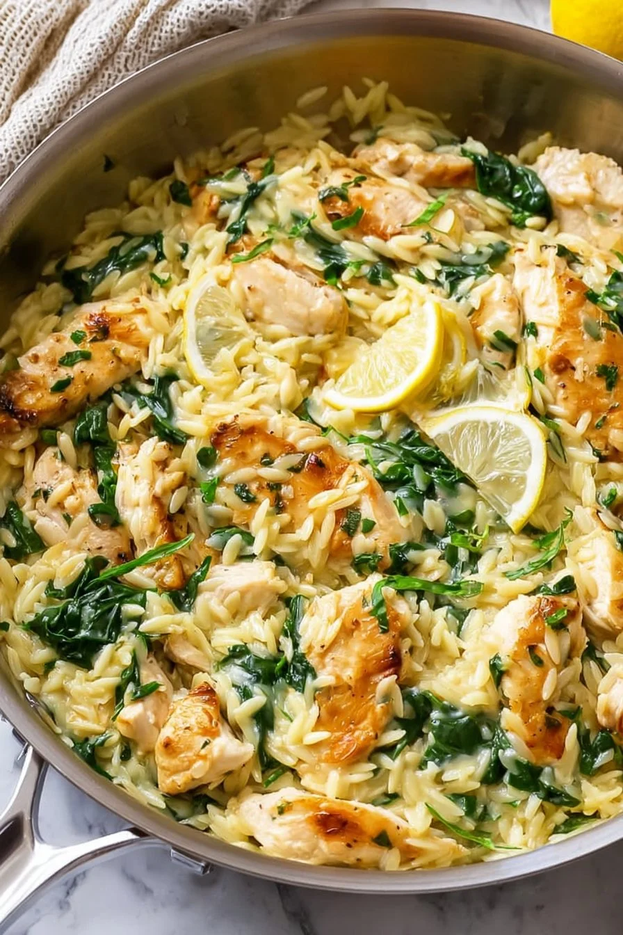 Delicious Lemon Chicken Orzo with Spinach served in a bowl.