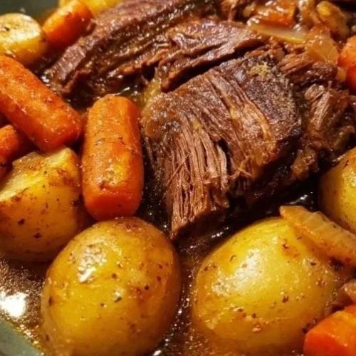 Delicious pot roast served with vegetables and gravy