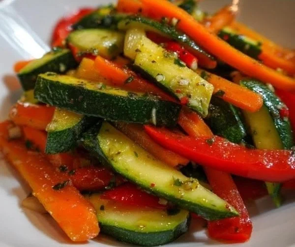 Colorful sautéed vegetables in a skillet, showcasing vibrant bell peppers and broccoli.