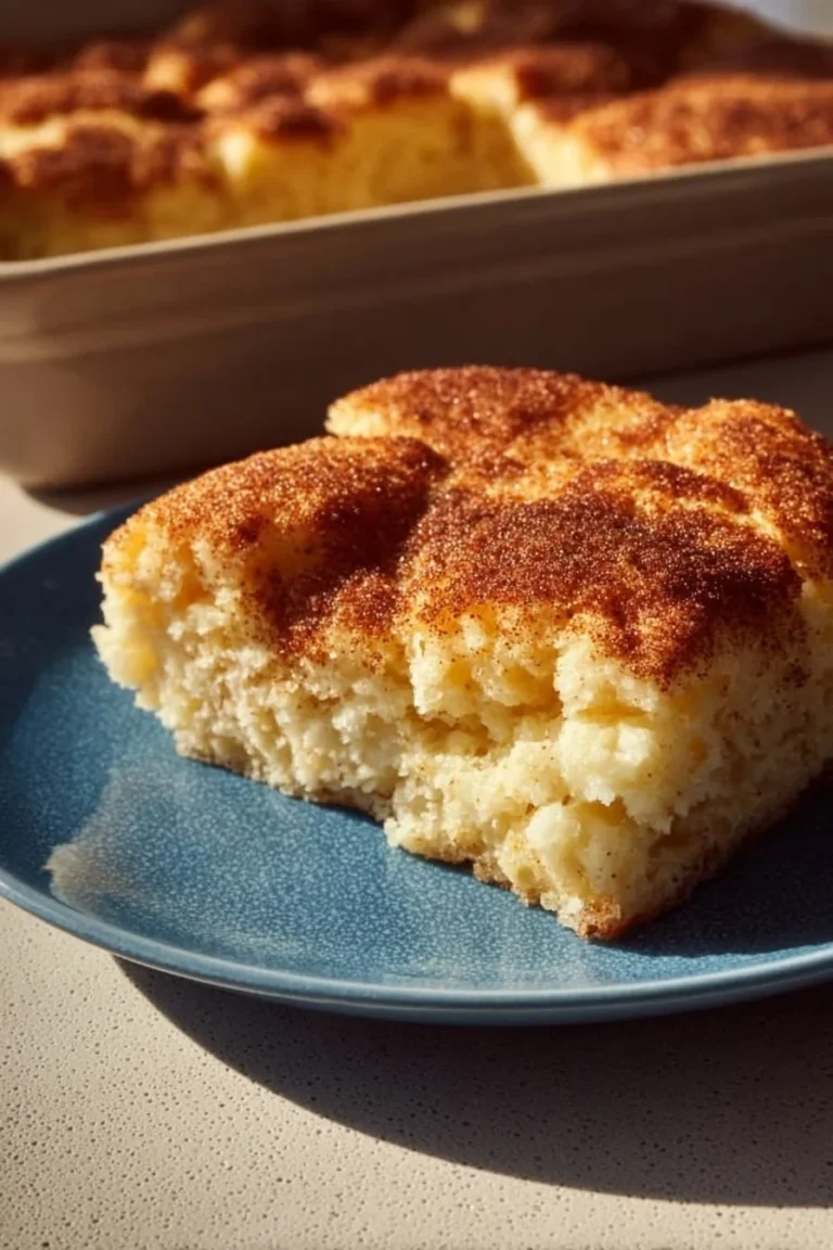 Delicious Snickerdoodle Cobbler topped with cinnamon sugar and served warm.