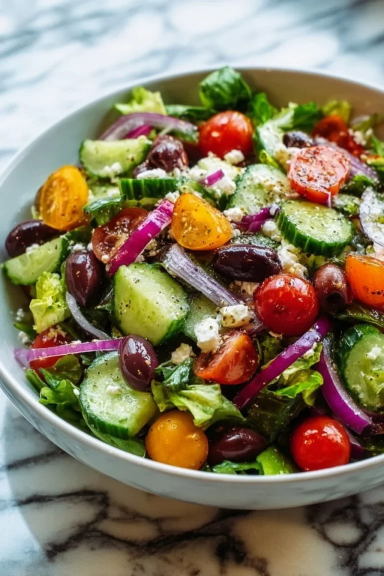 A vibrant bowl of Sunshine Salad featuring colorful fruits and vegetables.