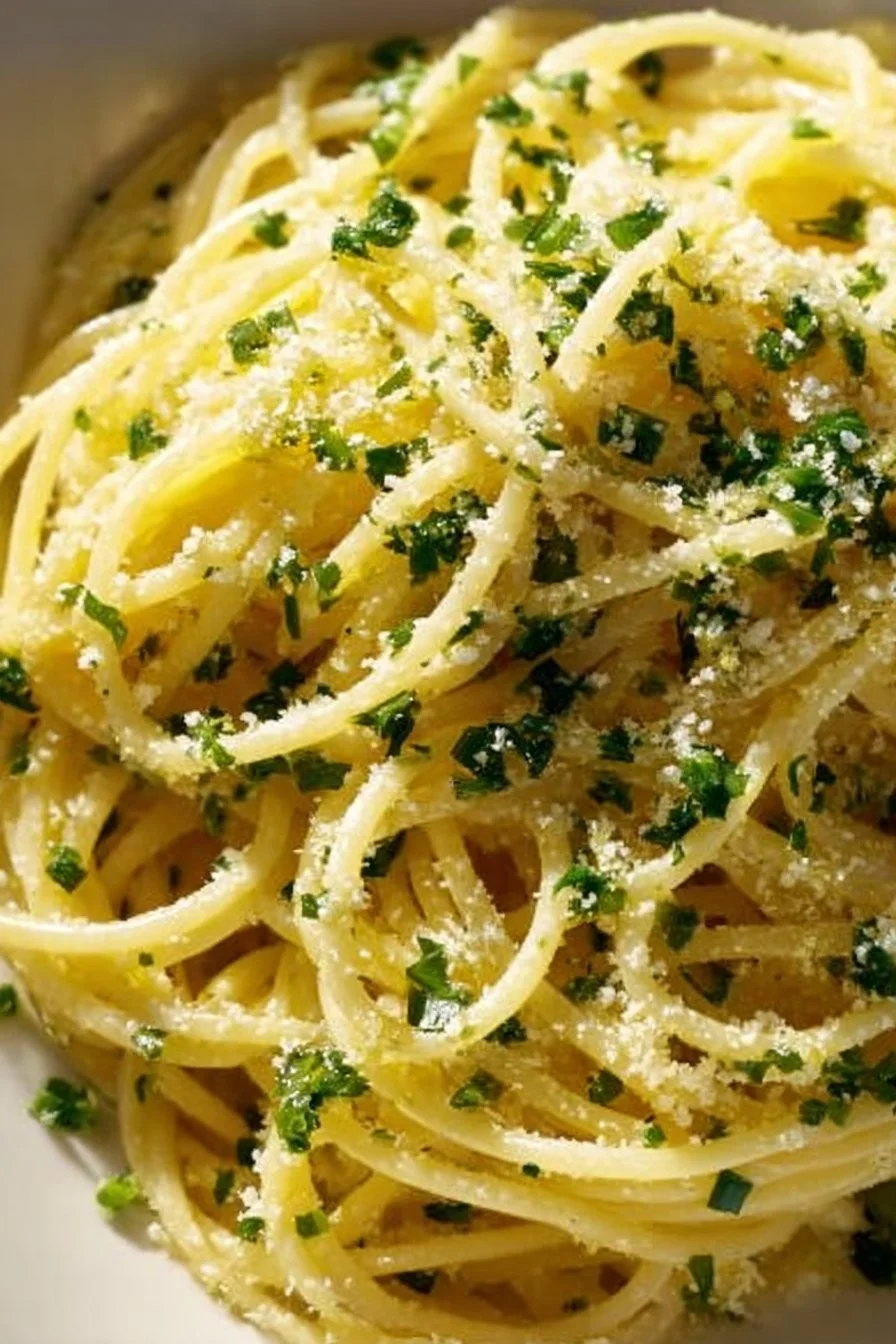 Bright and zesty lemon pasta dish garnished with fresh herbs