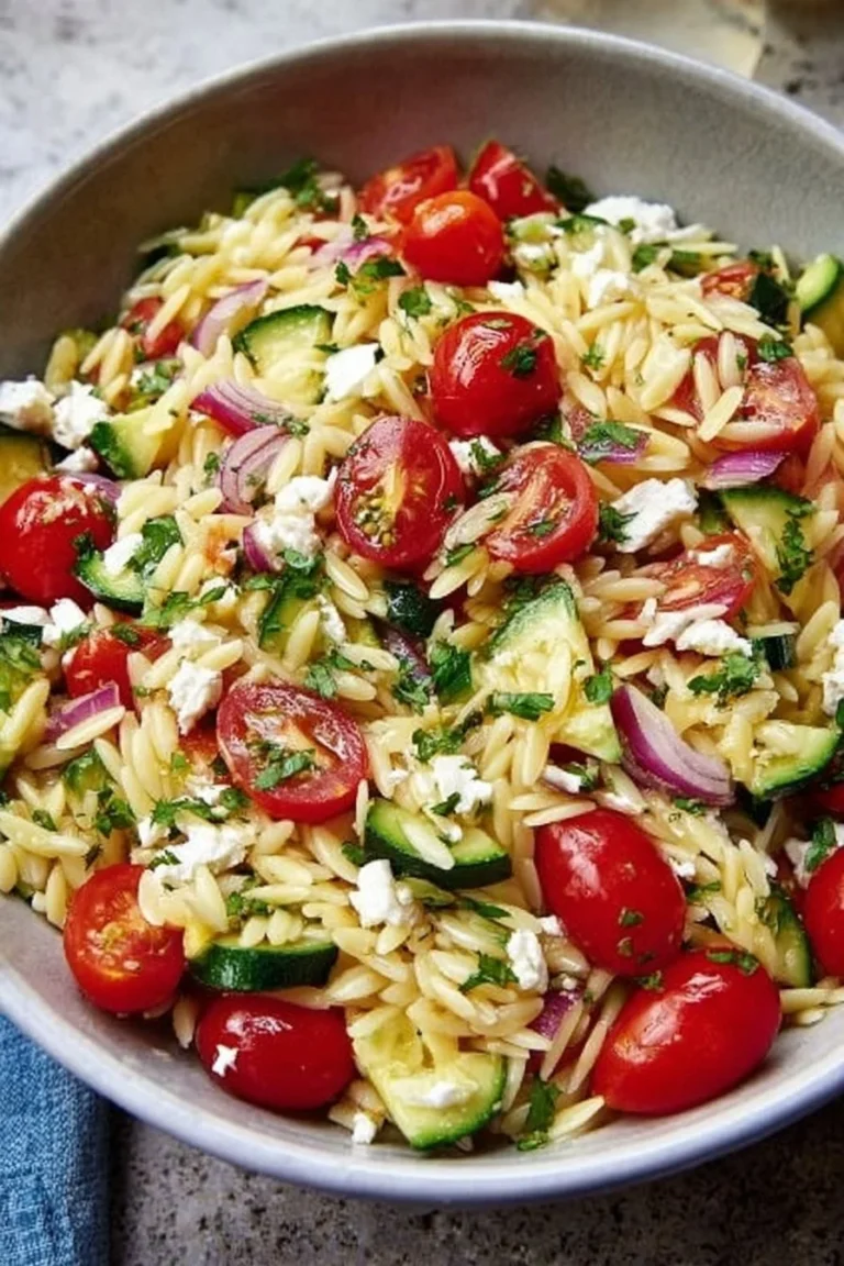 Colorful Orzo Pasta Salad with fresh vegetables and herbs