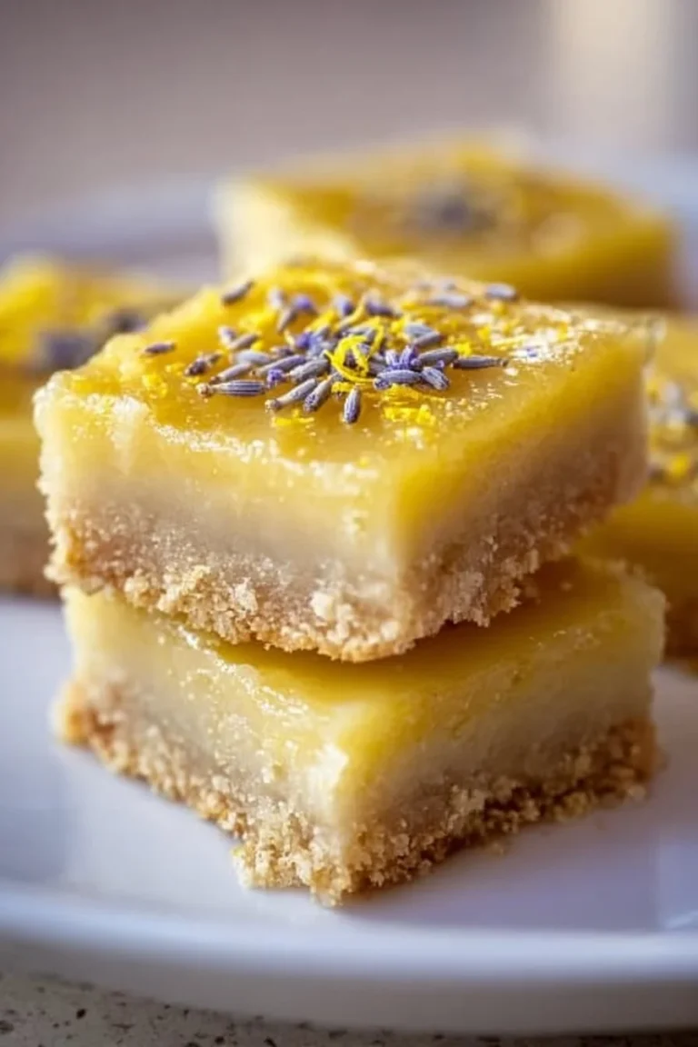 Zesty lavender lemon bars with a lemon glaze and lavender sprigs on top